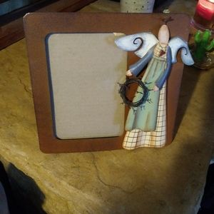 Photograph frame with angel